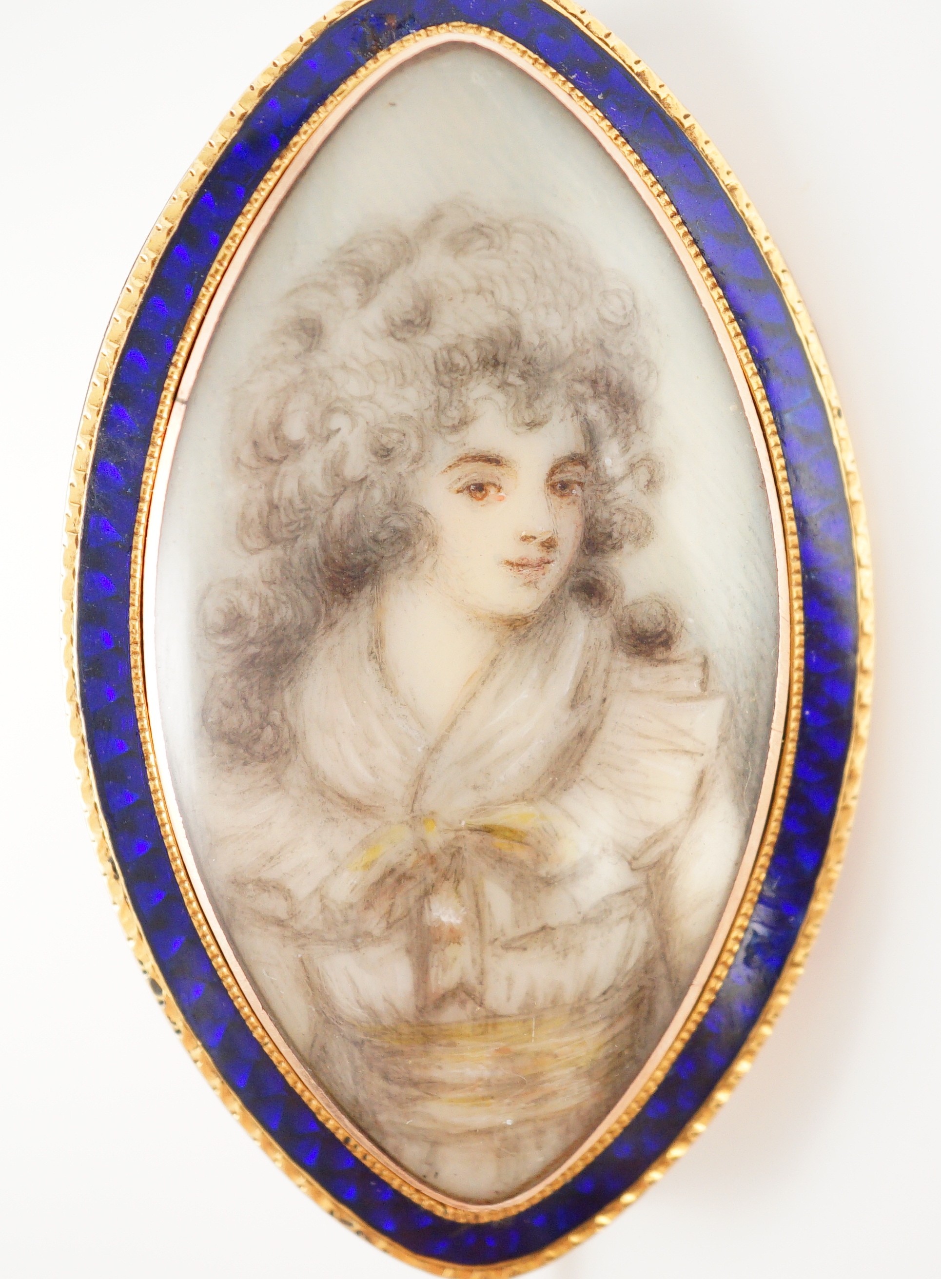 A Regency gold and enamel mounted miniature inset mourning brooch